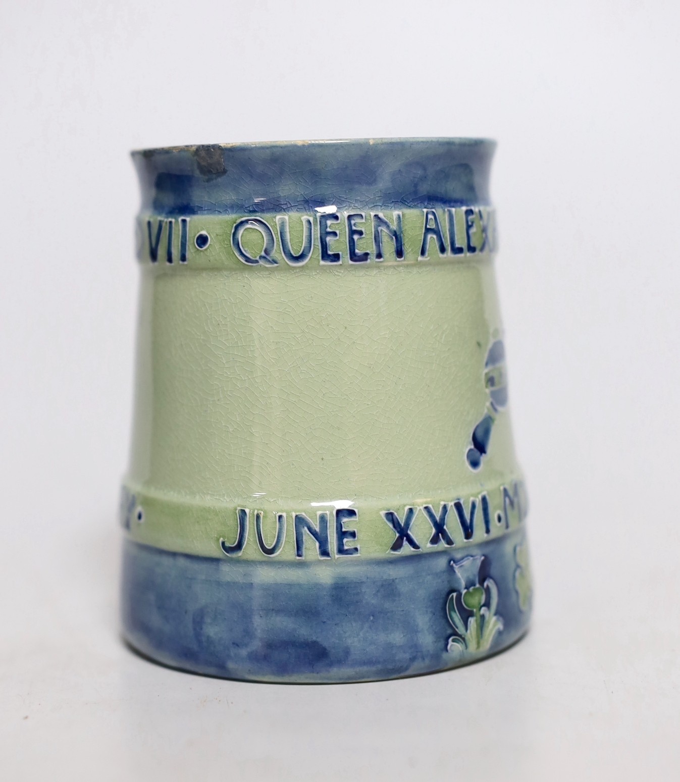 A Moorcroft Coronation of Edward VII and Queen Alexandra 1902. Tapering mug decorated in blue with underside inscription, From Mr and Mrs Lazenby Liberty, Lee Manor, Bucks and monograms. no. 112 of 250, 9.5cm tall
